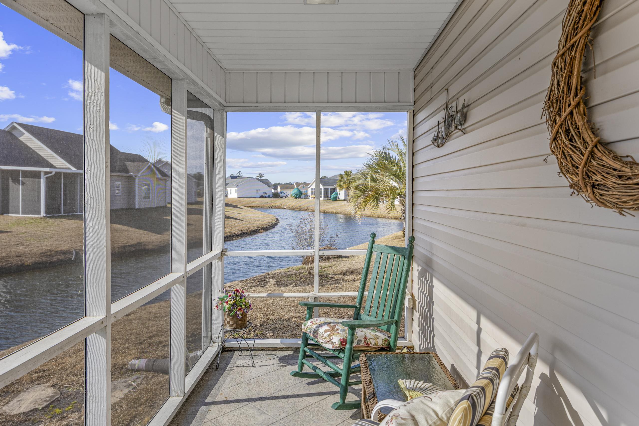 722 Downing Court Longs, SC 29568 - Photo 27 of 40 Screen Porch with a water view