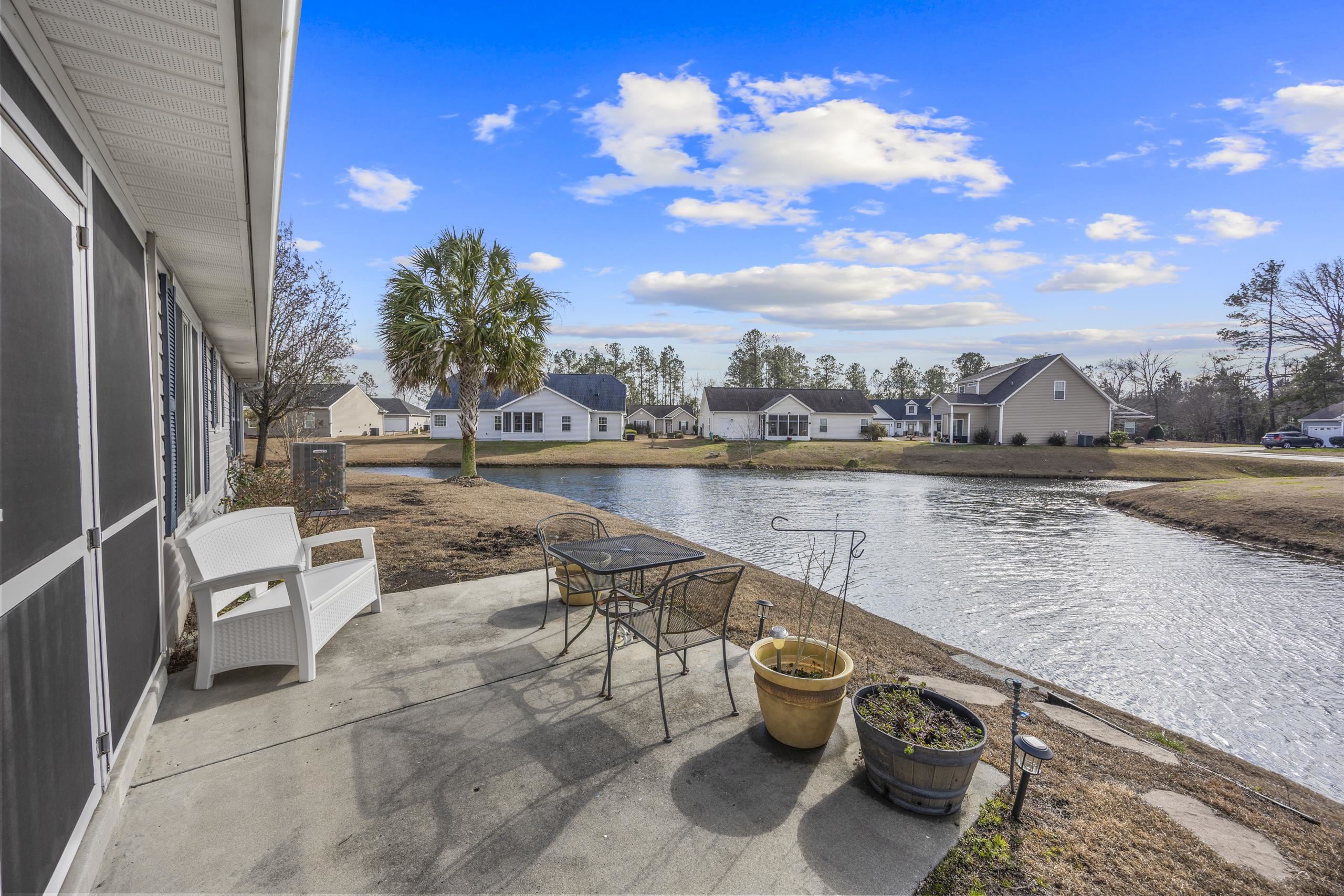 722 Downing Court Longs, SC 29568 - Photo 29 of 40 View of patio with a residential view and a water view