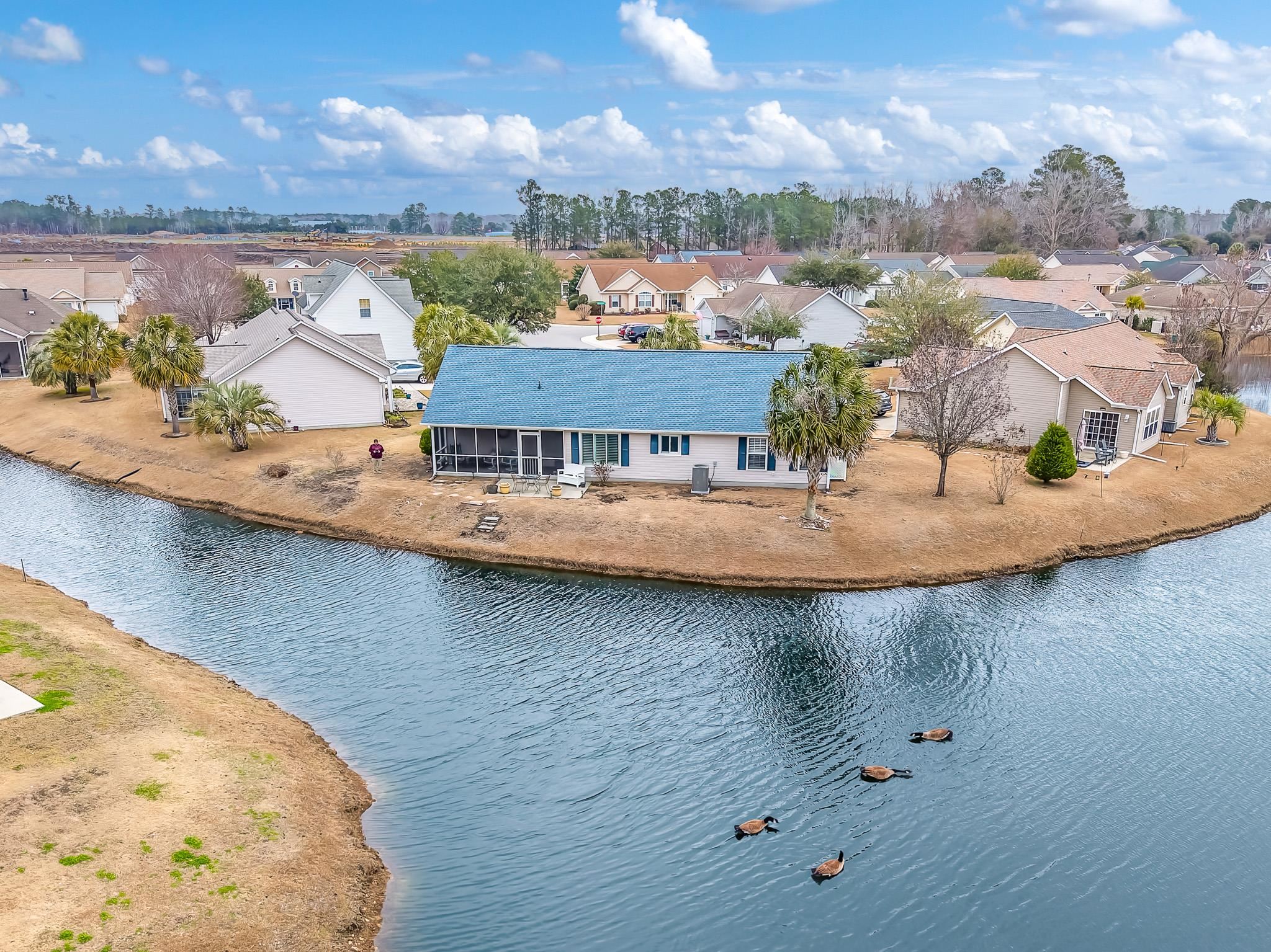 722 Downing Court Longs, SC 29568 - Photo 34 of 40 Aerial perspective of suburban area with a nearby body of water