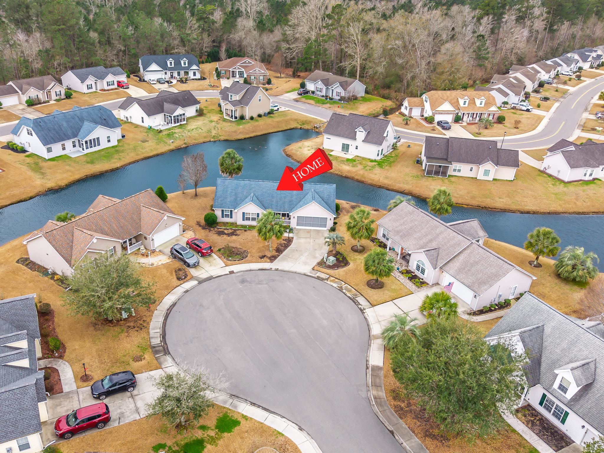 722 Downing Court Longs, SC 29568 - Photo 35 of 40 Aerial view of property's location with nearby suburban area and a large body of water