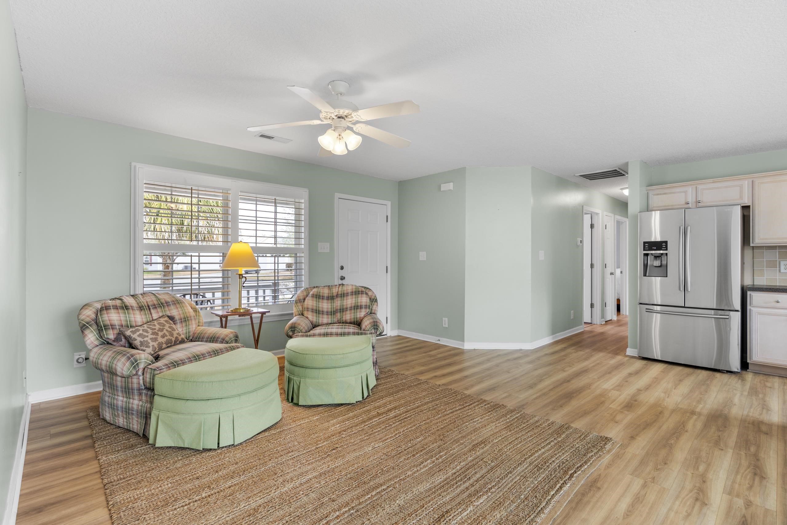722 Downing Court Longs, SC 29568 - Photo 4 of 40 Living Room featuring light wood finished floors and a ceiling fan