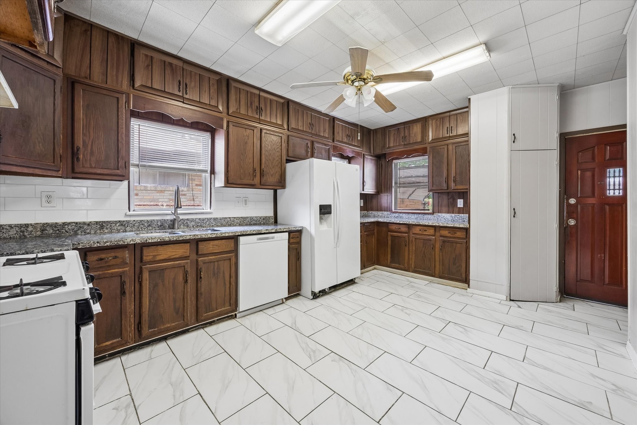 1409 Pearson Street Houston, TX 77023 - Photo 5 of 14 The kitchen over looking the backyard, offering abundant cabinet storage
