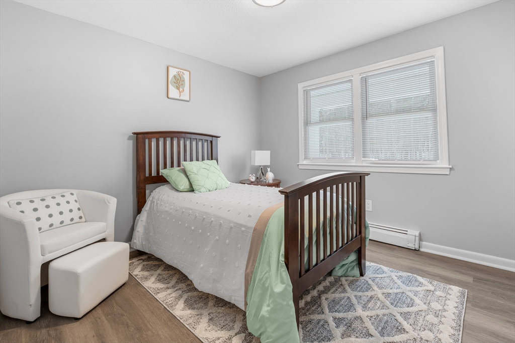 263 Great Road Shirley, MA 01464 - Photo 16 of 30 a bedroom with a bed and a window