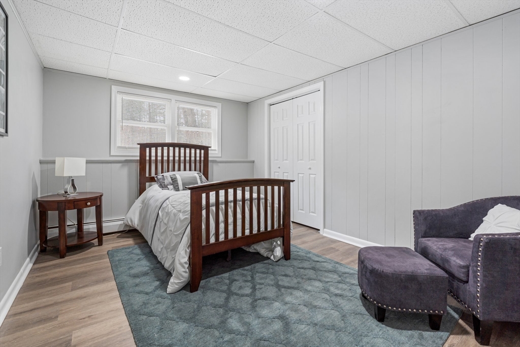 263 Great Road Shirley, MA 01464 - Photo 21 of 30 a bed room with a bed and a window