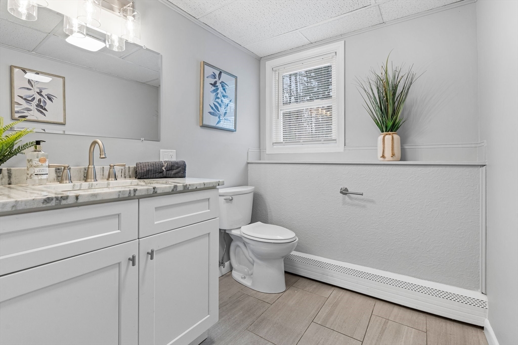 263 Great Road Shirley, MA 01464 - Photo 24 of 30 a bathroom with a toilet sink and mirror