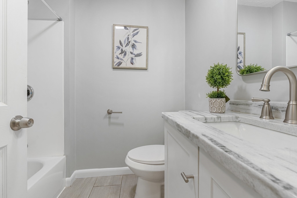 263 Great Road Shirley, MA 01464 - Photo 25 of 30 a bathroom with a sink a toilet and shower