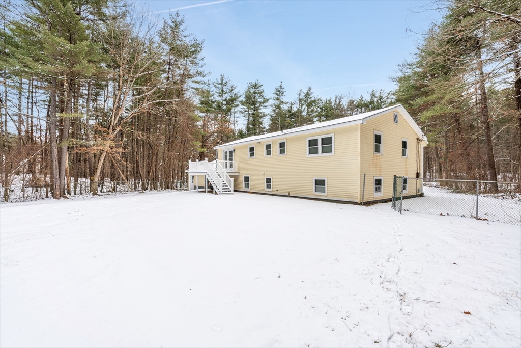 263 Great Road Shirley, MA 01464 - Photo 28 of 30 a view of a white house with snow in the background
