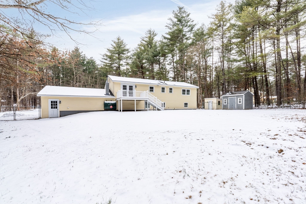 263 Great Road Shirley, MA 01464 - Photo 29 of 30 a view of a white house with a snow