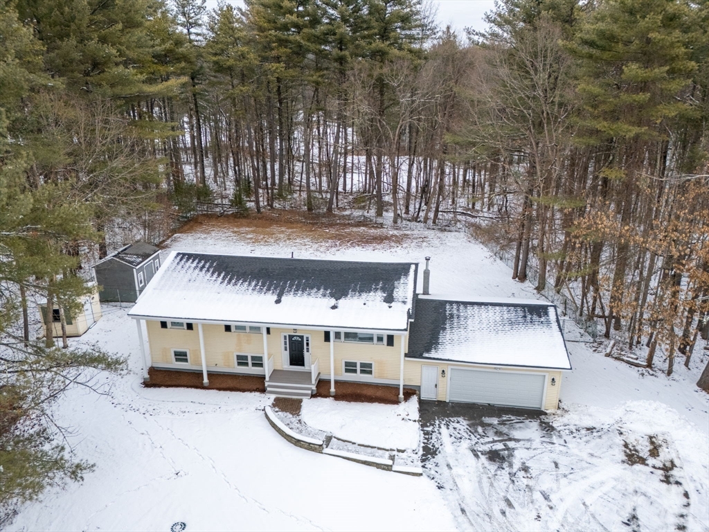 263 Great Road Shirley, MA 01464 - Photo 3 of 30 a front view of a house with a yard