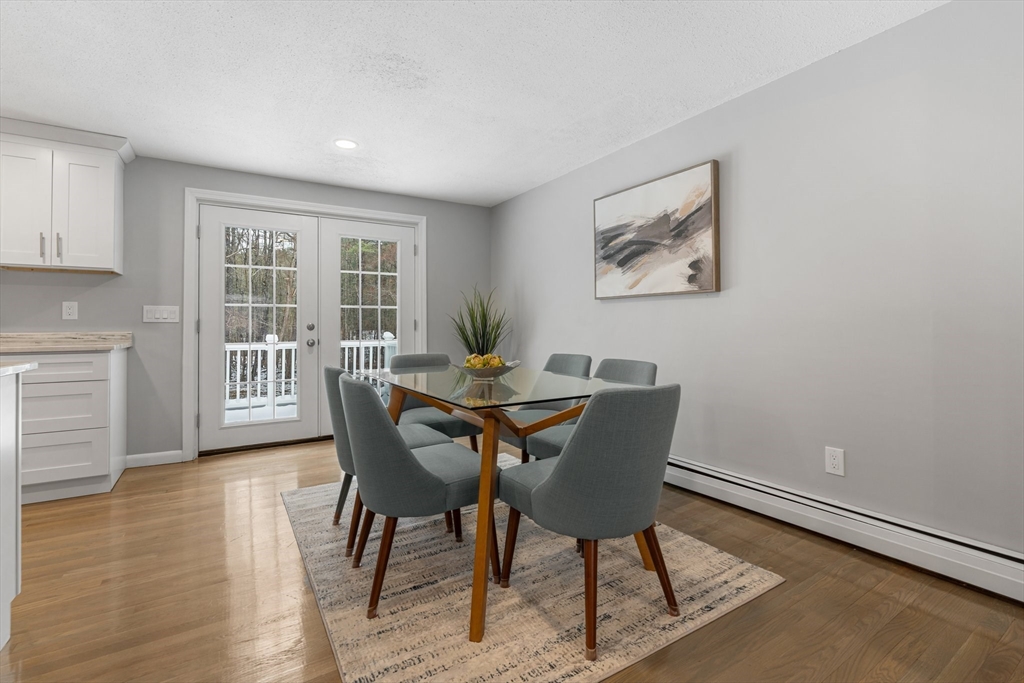 263 Great Road Shirley, MA 01464 - Photo 7 of 30 a view of a dining room with furniture window and wooden floor