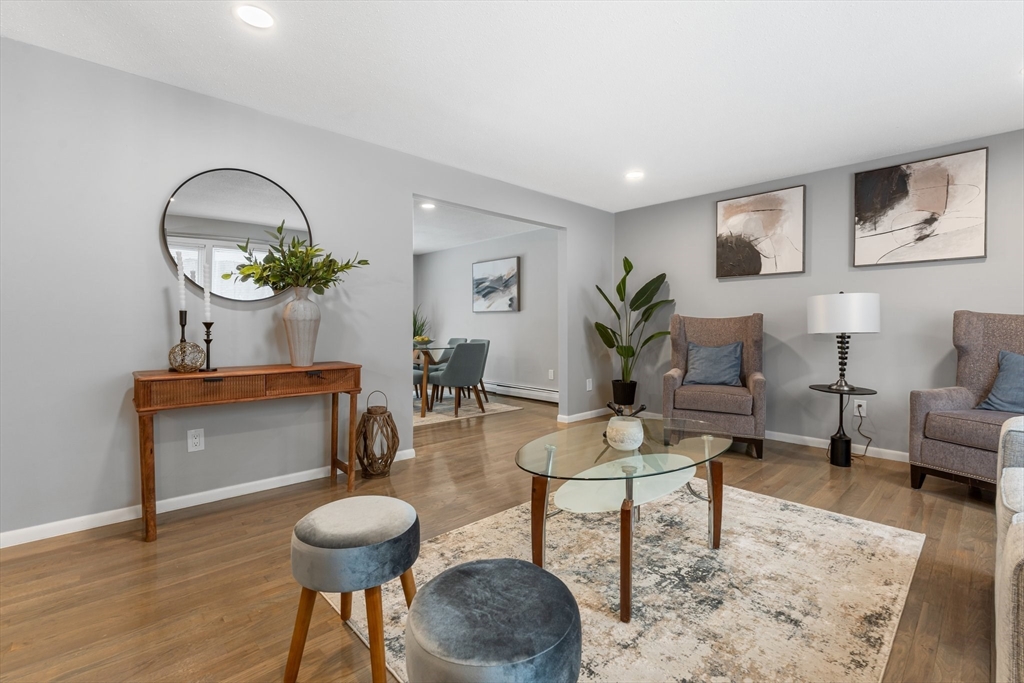 263 Great Road Shirley, MA 01464 - Photo 9 of 30 a living room with furniture a table and wooden floor