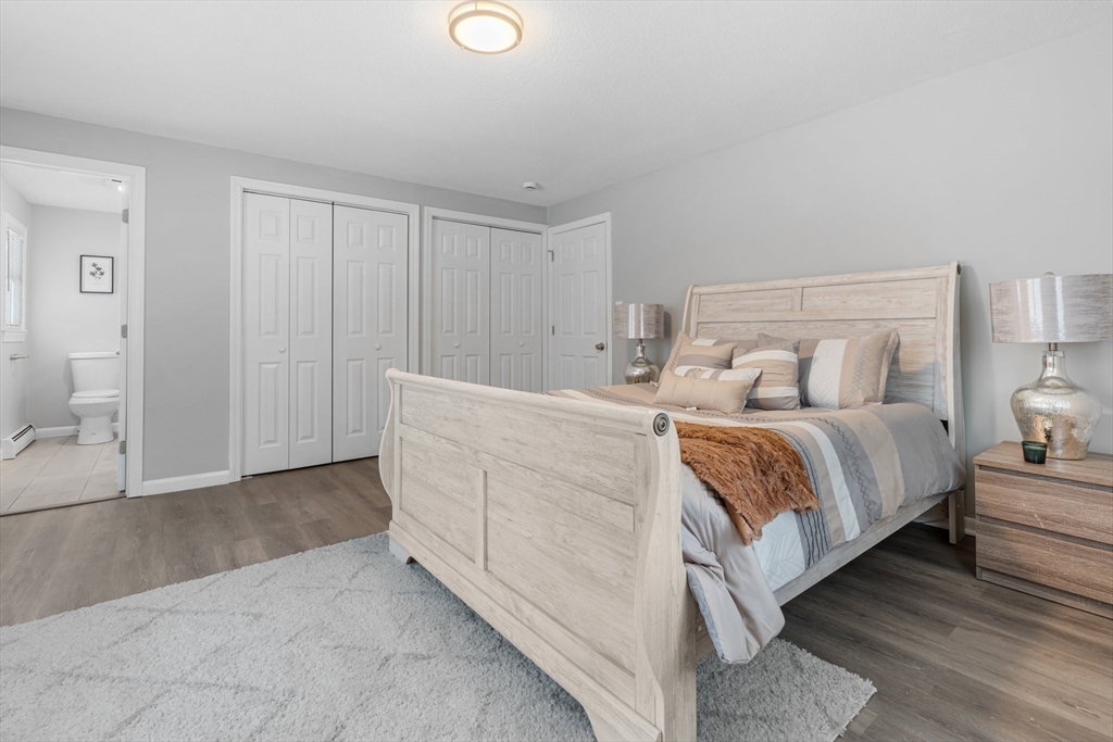 263 Great Road Shirley, MA 01464 - Photo 10 of 30 a room with a bed and a lamp
