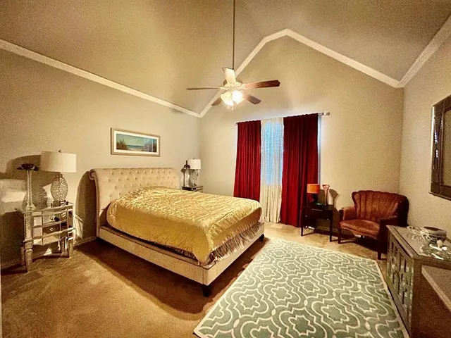 a bed room with a bed and a chair