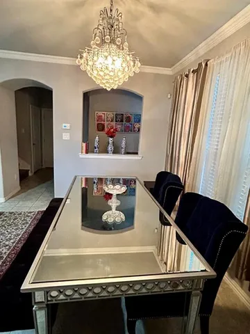 a room with furniture and a chandelier