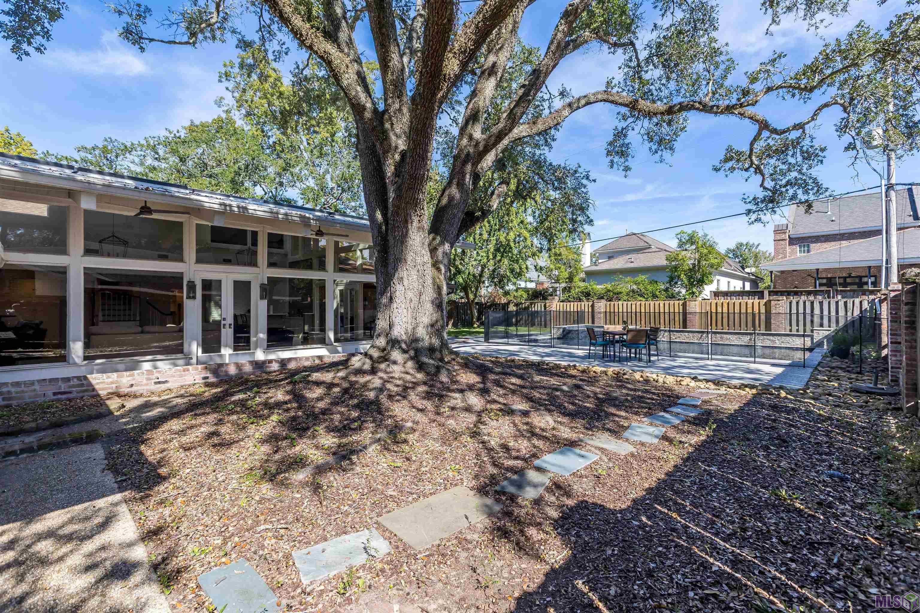 4843 Sweetbriar Street Baton Rouge, LA 70808 - Photo 4 of 56 pool and sunroom view