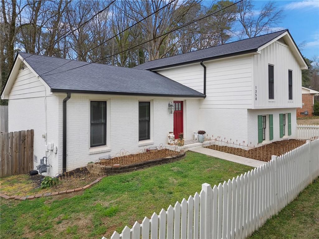 1350 Sanden Ferry Drive Decatur, GA 30033 - Photo 1 of 1 a house view with a garden space