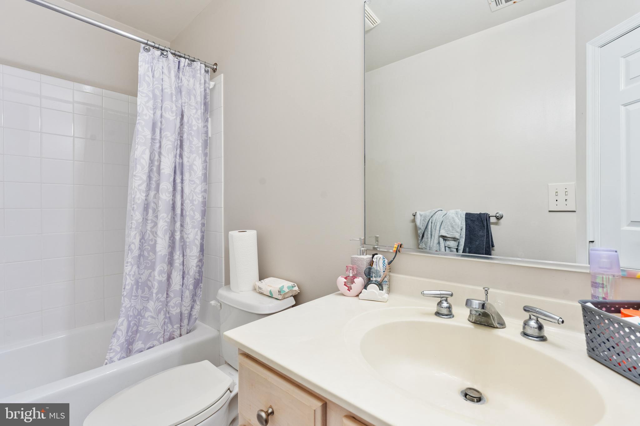 7815 Stable Way Potomac, MD 20854 - Photo 17 of 36 a bathroom with a sink toilet and shower