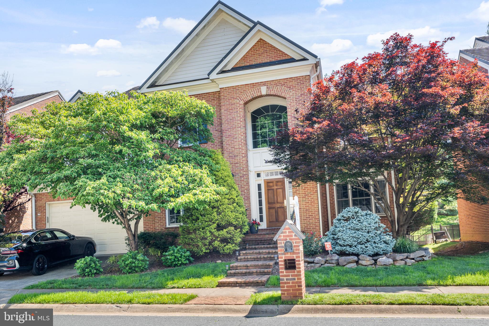 7815 Stable Way Potomac, MD 20854 - Photo 2 of 36 a front view of a house with garden