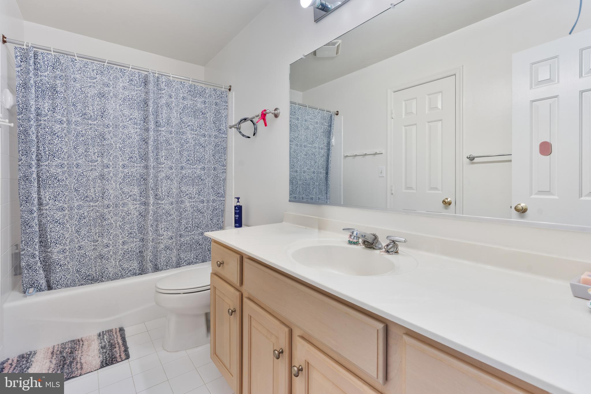 7815 Stable Way Potomac, MD 20854 - Photo 23 of 36 a bathroom with a sink a toilet and shower