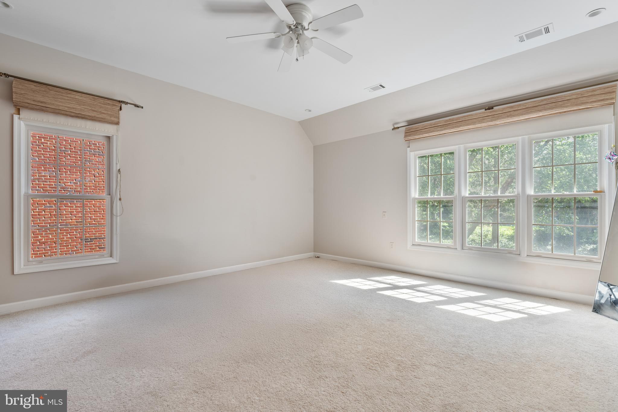 7815 Stable Way Potomac, MD 20854 - Photo 26 of 36 an empty room with a window and a ceiling fan