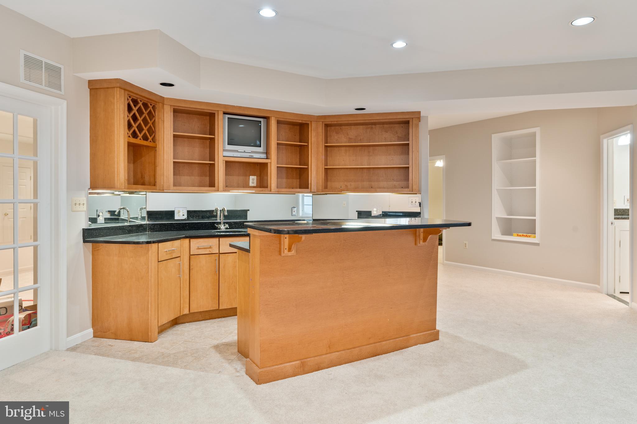 7815 Stable Way Potomac, MD 20854 - Photo 31 of 36 a kitchen with granite countertop a stove and cabinets