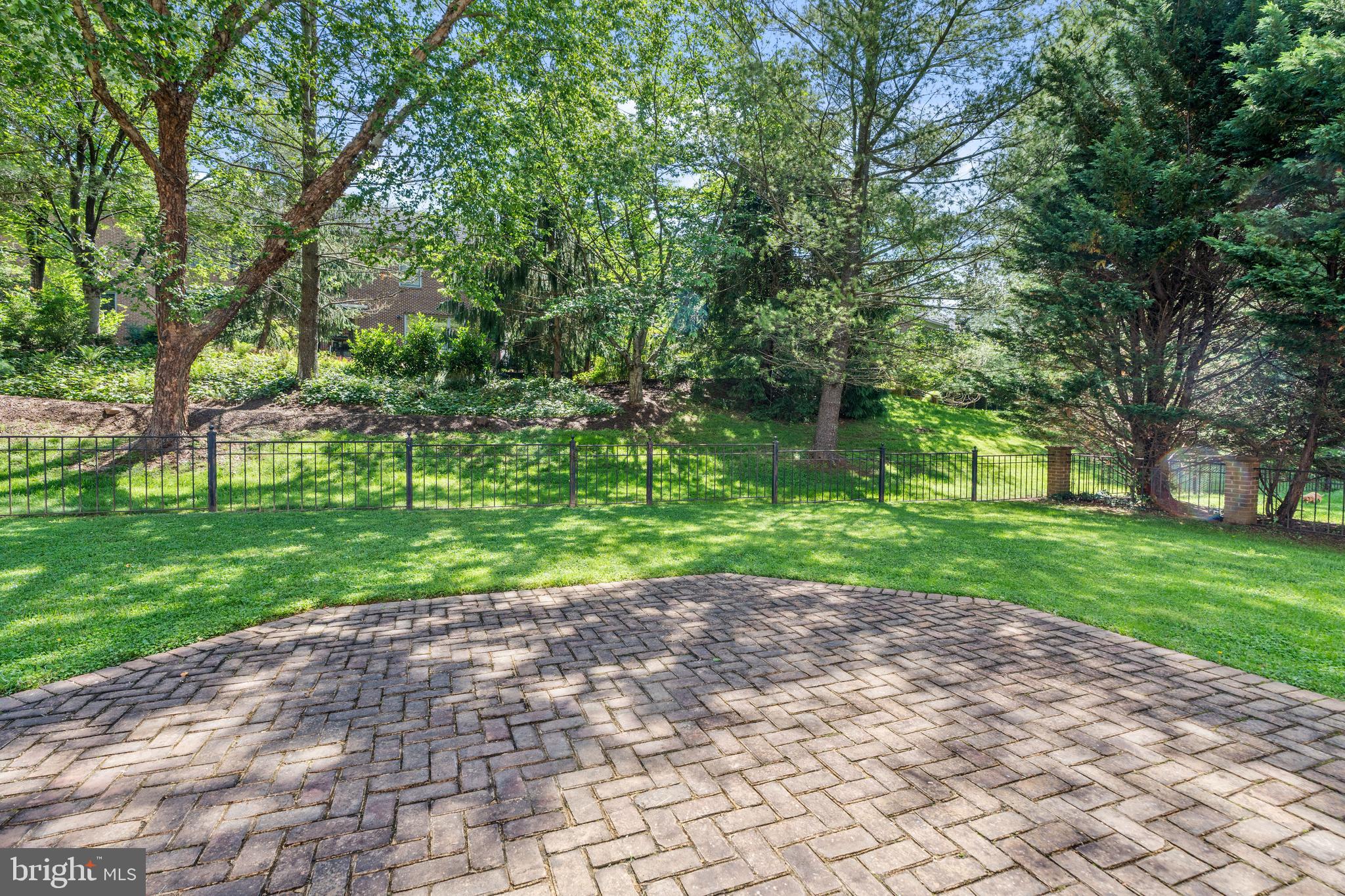 7815 Stable Way Potomac, MD 20854 - Photo 33 of 36 a view of a yard with plants and a large tree