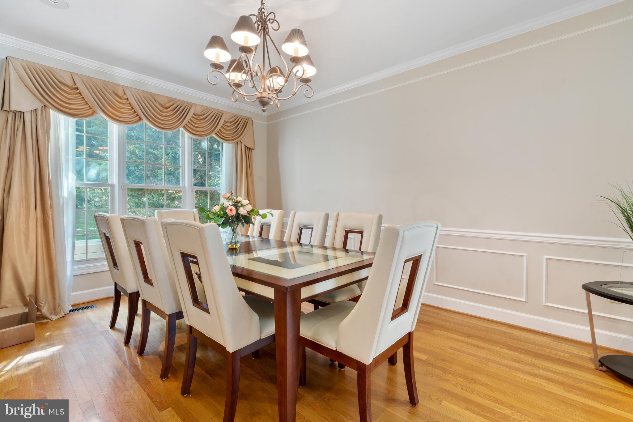 7815 Stable Way Potomac, MD 20854 - Photo 7 of 36 a view of a dining room with furniture window and wooden floor