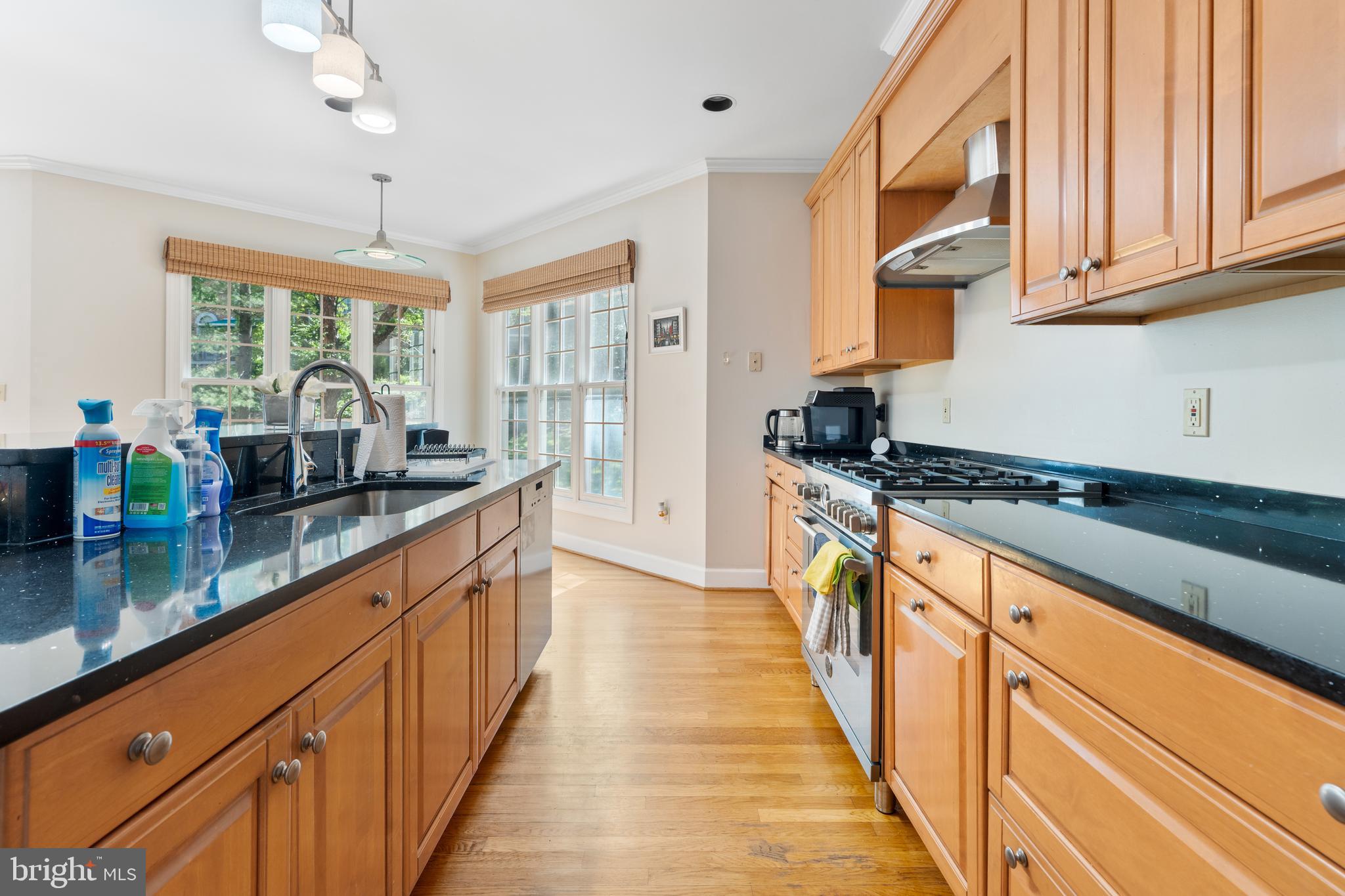 7815 Stable Way Potomac, MD 20854 - Photo 8 of 36 a large kitchen with granite countertop a large counter top space a sink a window and stainless steel appliances