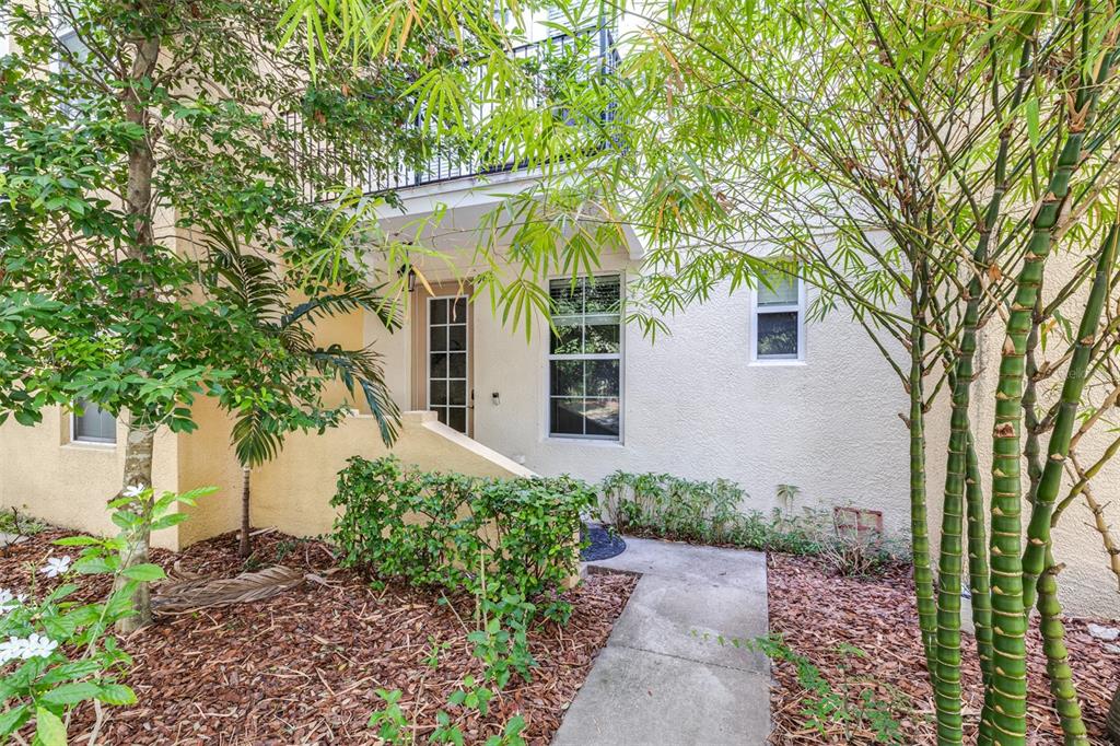 962 Sombra Street Tampa, FL 33619 - Photo 1 of 24 a front view of a house with garden