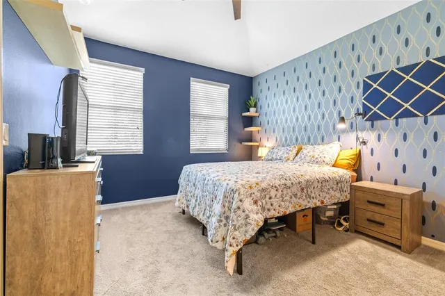 a bedroom with a bed and a dresser