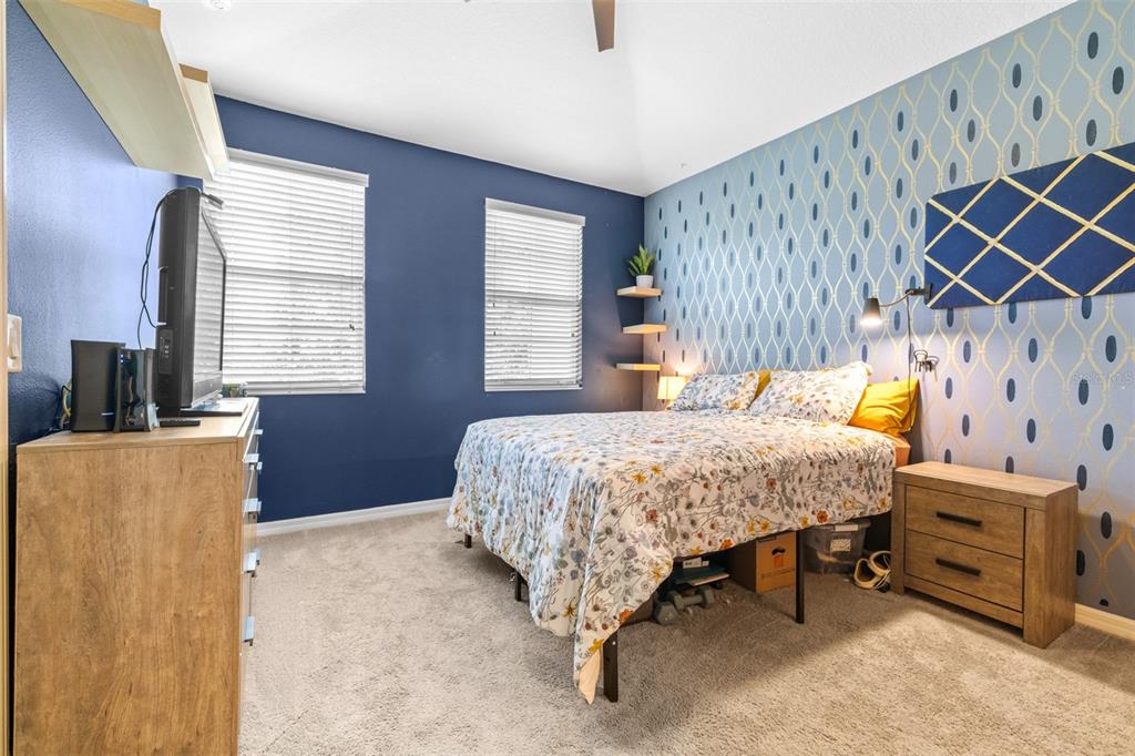 962 Sombra Street Tampa, FL 33619 - Photo 15 of 24 a bedroom with a bed and a dresser