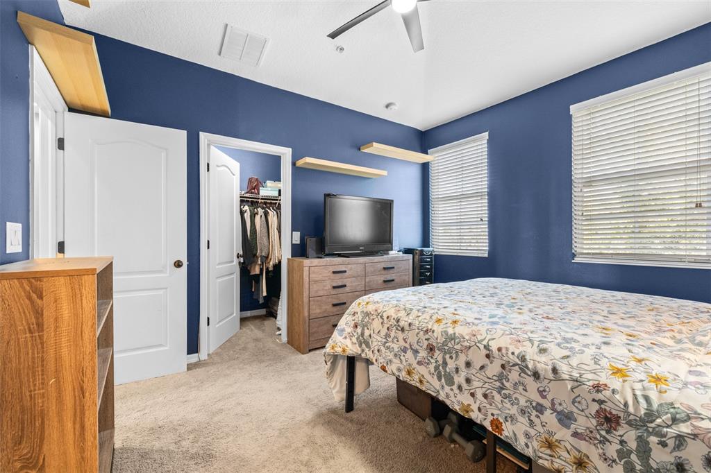 962 Sombra Street Tampa, FL 33619 - Photo 17 of 24 a bedroom with a bed and a flat screen tv