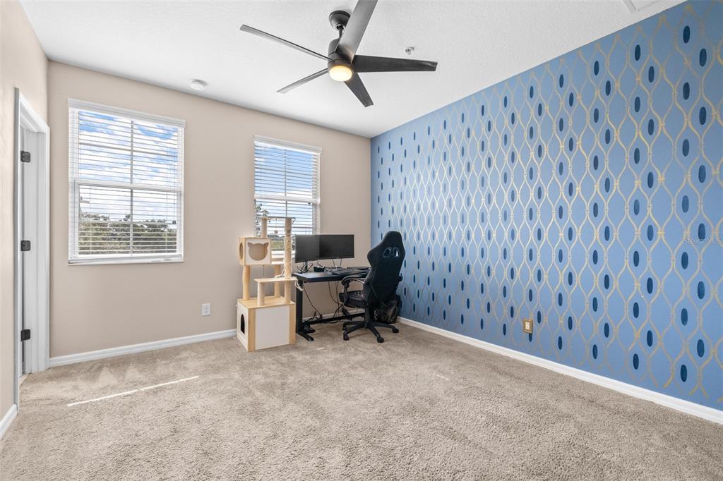 962 Sombra Street Tampa, FL 33619 - Photo 19 of 24 a view of a workspace with furniture and a window