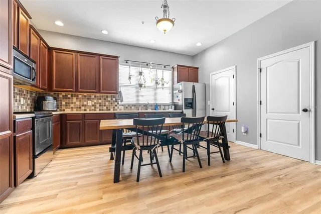a view of a dining room with furniture window and wooden floor