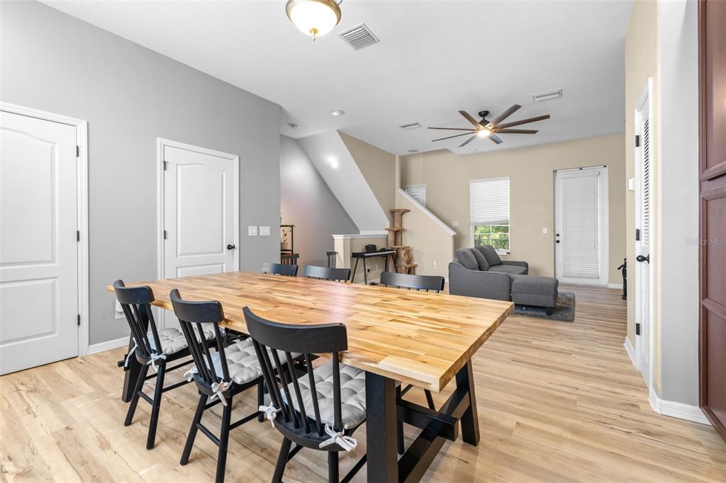 962 Sombra Street Tampa, FL 33619 - Photo 10 of 24 a view of a dining room with furniture and wooden floor