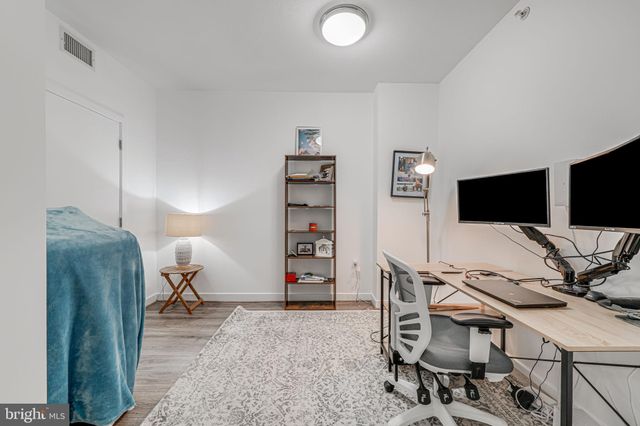 a view of a livingroom with furniture and a flat screen tv