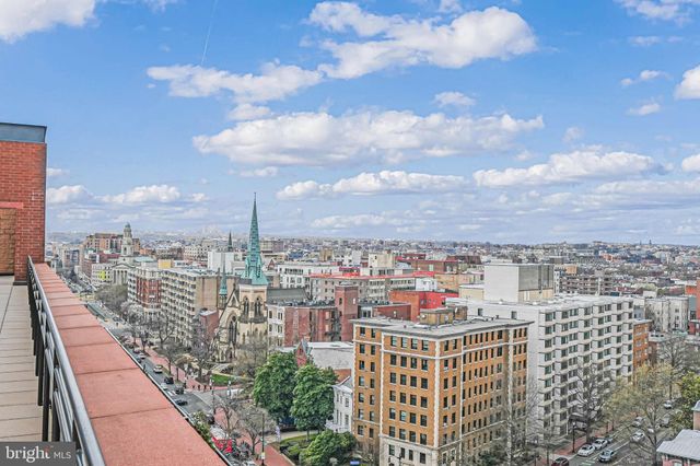 a view of a hallway with a bathroom