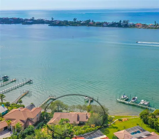 an aerial view of a house with a lake view