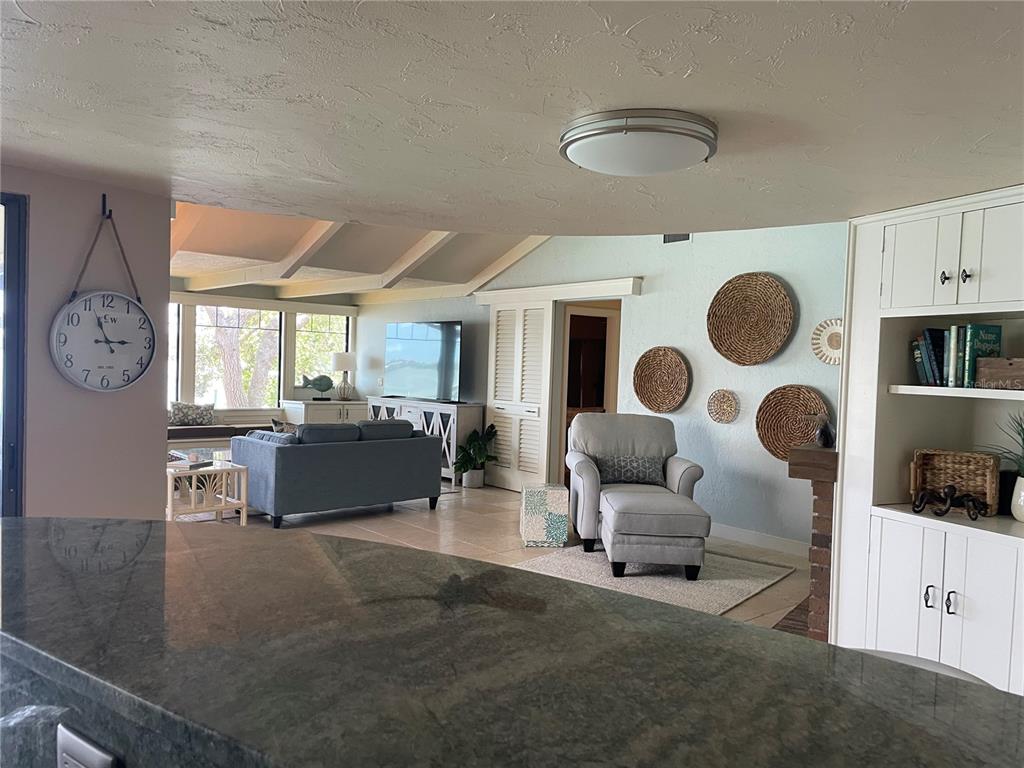 421 Waterside Lane Nokomis, FL 34275 - Photo 12 of 48 a living room with furniture and a large window