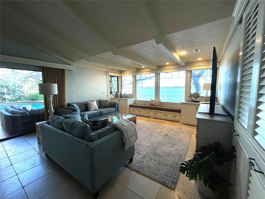421 Waterside Lane Nokomis, FL 34275 - Photo 14 of 48 a living room with furniture and a large window