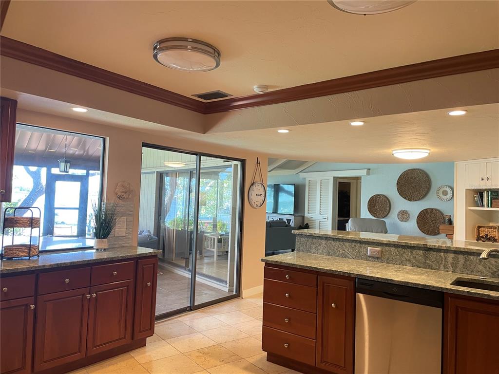 421 Waterside Lane Nokomis, FL 34275 - Photo 16 of 48 a spacious bathroom with a granite countertop double vanity sink and mirror