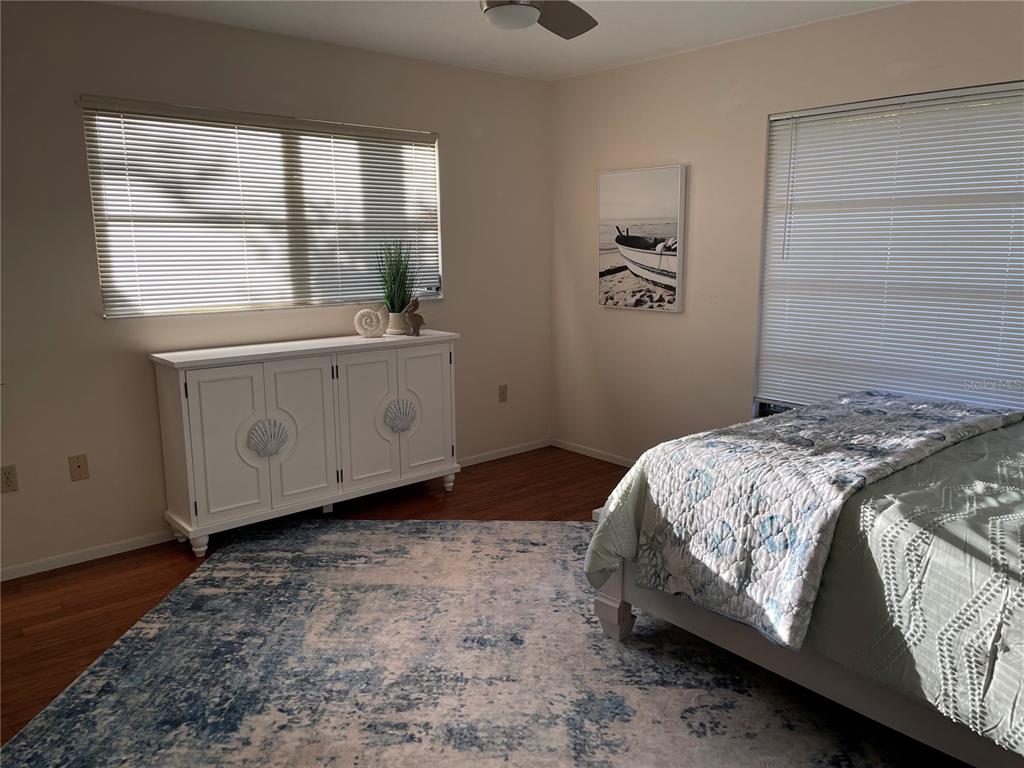 421 Waterside Lane Nokomis, FL 34275 - Photo 29 of 48 a bedroom with a bed and a window