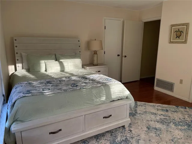 a bedroom with a bed and a view of bedroom