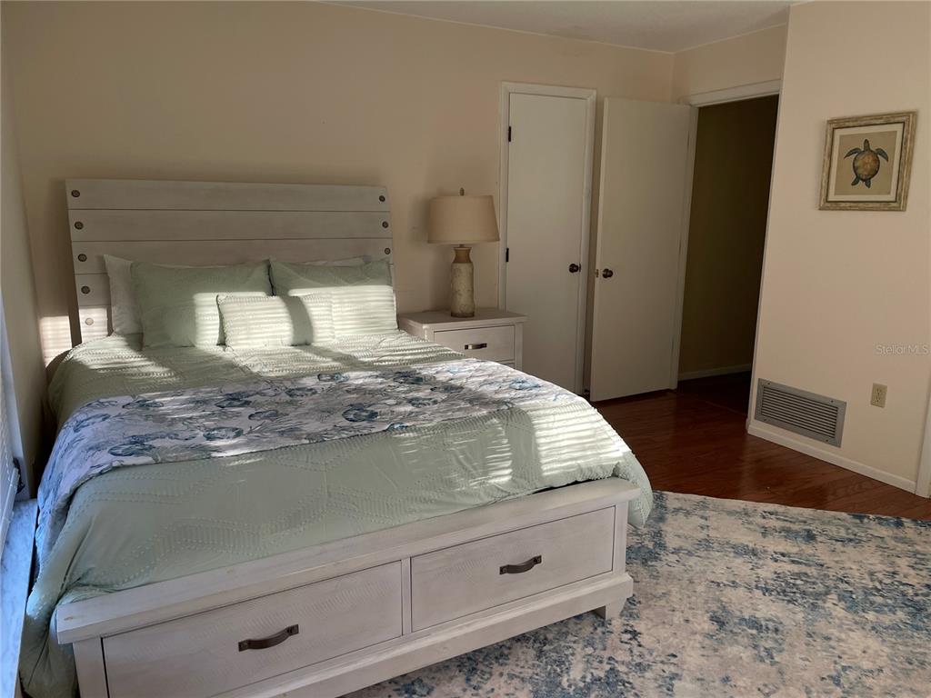 421 Waterside Lane Nokomis, FL 34275 - Photo 30 of 48 a bedroom with a bed and a view of bedroom