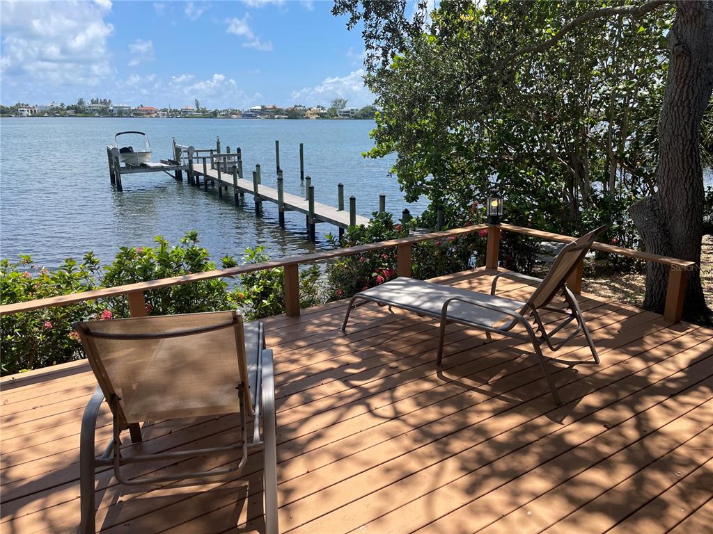 421 Waterside Lane Nokomis, FL 34275 - Photo 3 of 48 a terrace with outdoor seating and ocean view
