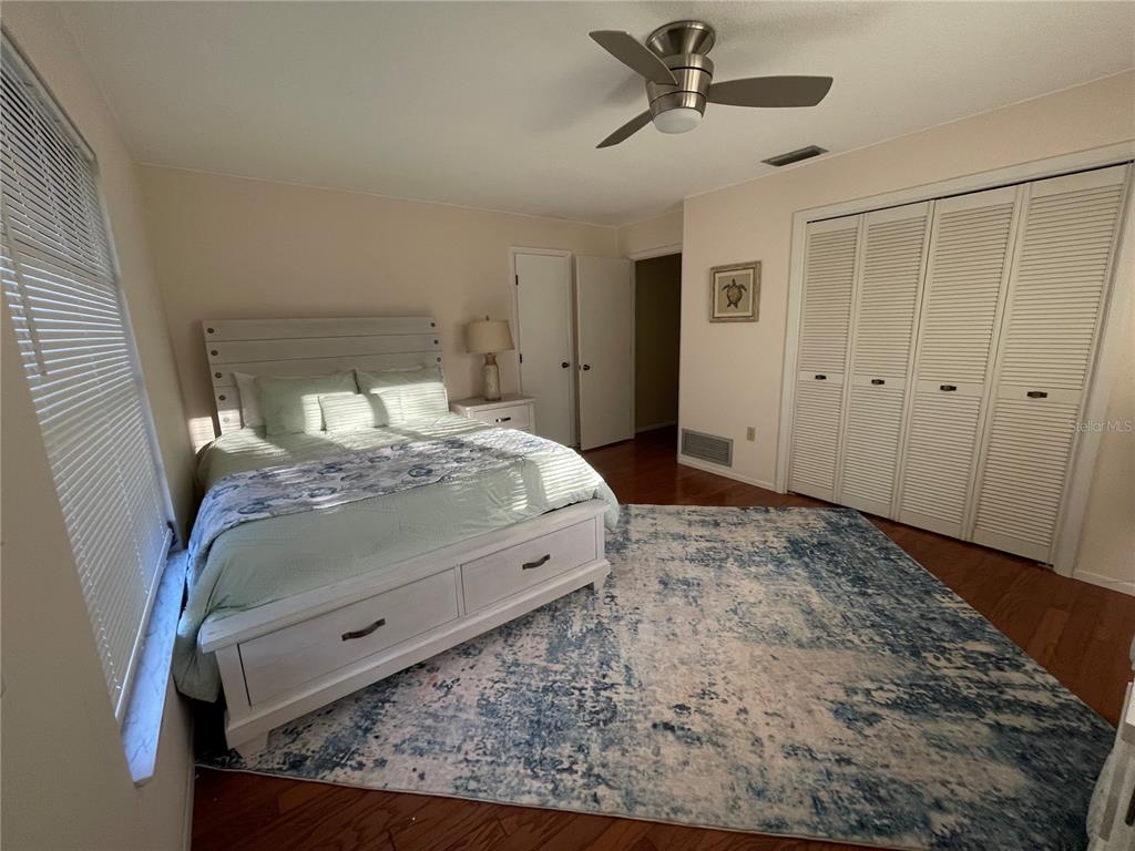 421 Waterside Lane Nokomis, FL 34275 - Photo 31 of 48 a bed sitting in a bedroom next to a window