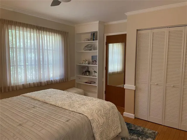 a bedroom with a bed and a closet