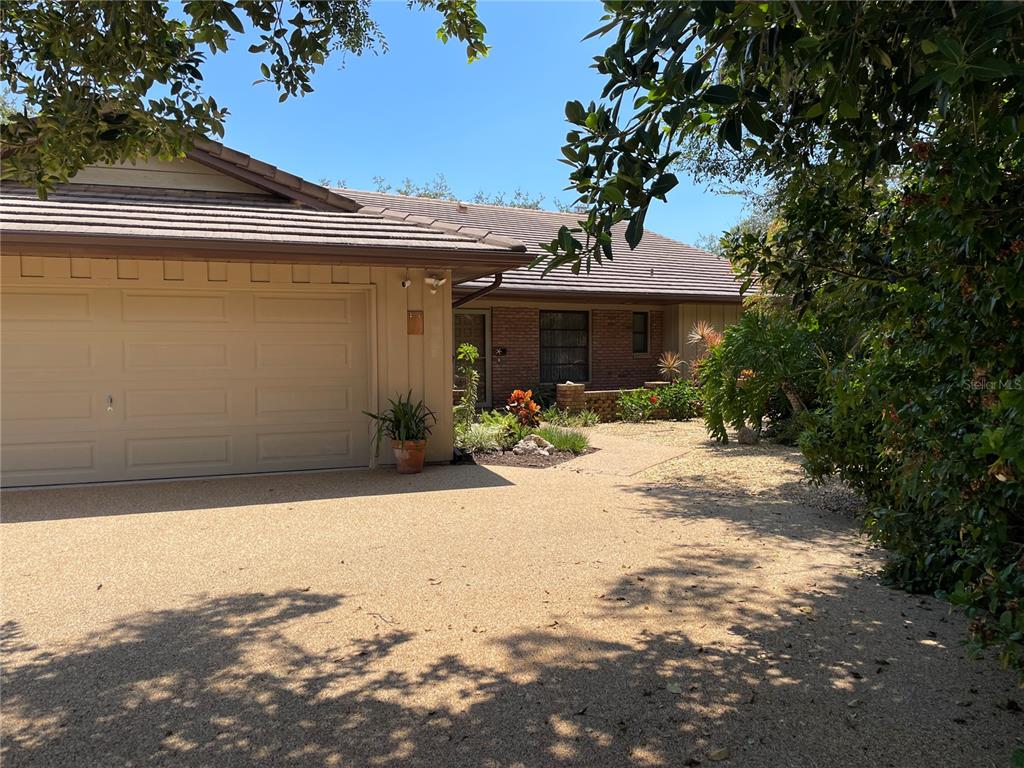 421 Waterside Lane Nokomis, FL 34275 - Photo 41 of 48 a front view of a house with a yard