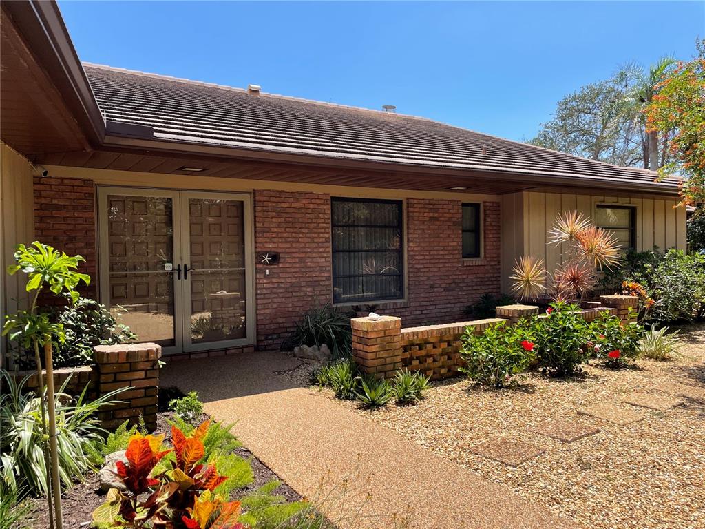 421 Waterside Lane Nokomis, FL 34275 - Photo 42 of 48 a front view of a house with a patio