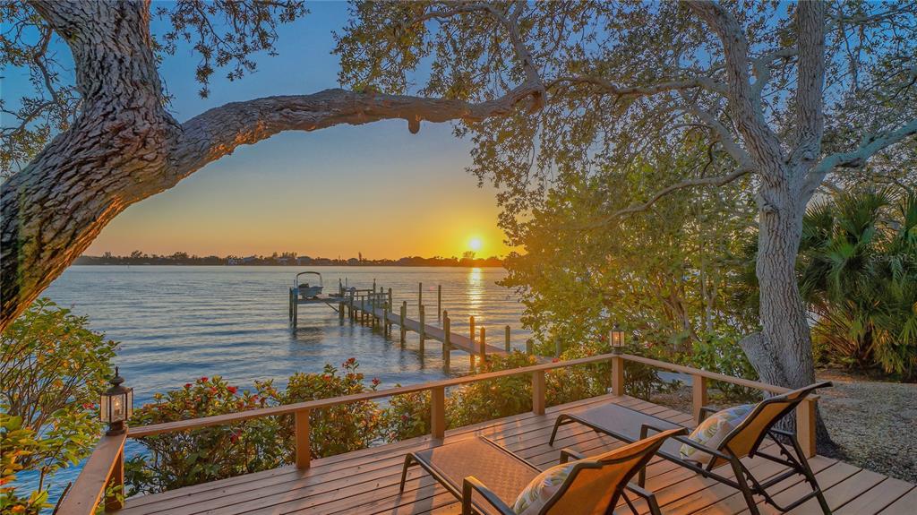 421 Waterside Lane Nokomis, FL 34275 - Photo 48 of 48 a view of a balcony with chair and wooden fence